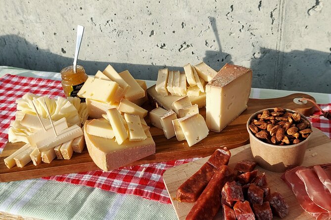 Cheese and chocolate on mountain summit - Bread, jam, cold cuts, and vegetarian options