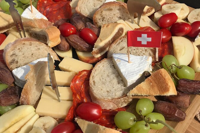 Cheese platter by Boat on Lake Thun, Interlaken - What’s on your platter: Swiss hard and soft cheese, plus wine options