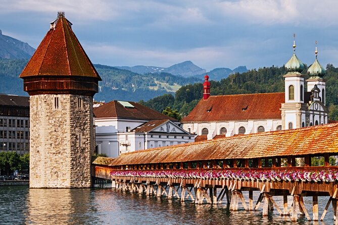 Exclusive Panoramic Train Journey though the Heart of Swiss - Quick Lucerne walk: Lion Monument, Chapel Bridge, Jesuit Church