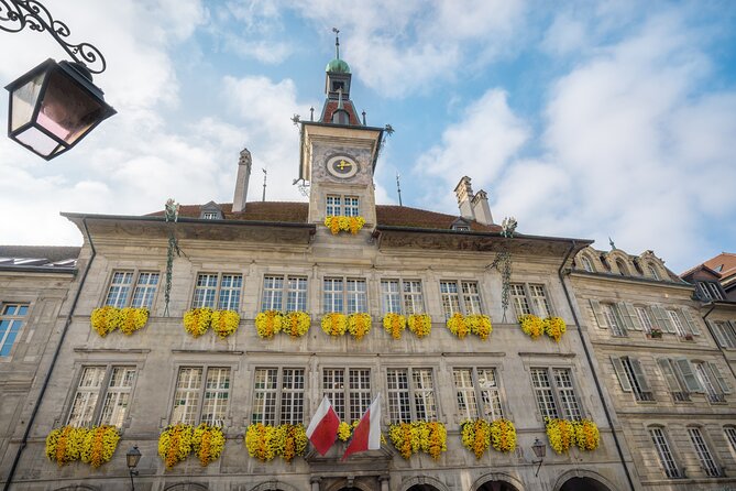Explore Lausanne in 60 minutes with a Local - Stop 5: Place de la Palud, town hall, and the hourly animated clock