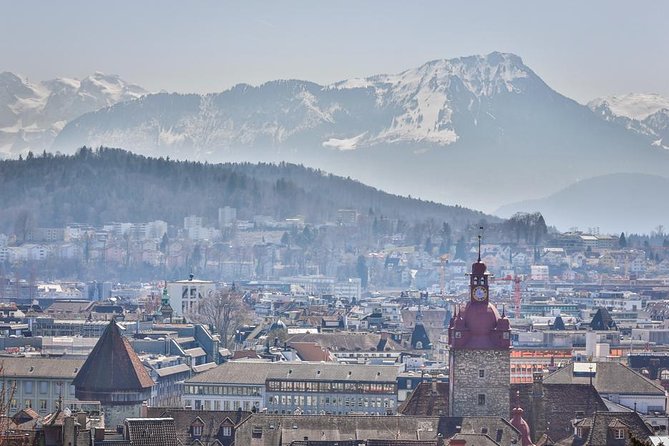 Lucerne Private Walking Tour with a castle visit! - Stop 2 and 3: Chapel Bridge and Wasserturm, the medieval icons