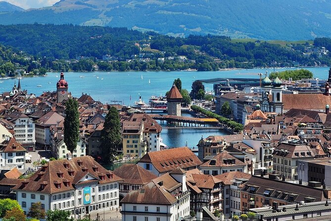 Lucerne Walking Tour: Explore Top Sights & Hidden Gems - Stop 1: Chapel Bridge, plus the painted story on the wood