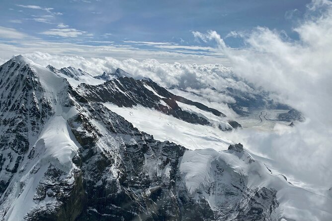 Private Swiss Alps helicopter tour over snow covered mountain peaks and glaciers - Schilthorn and the 007 connection: film terraces below you