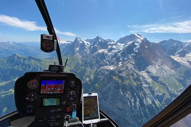 Private Swiss Alps helicopter tour over snow covered mountain peaks and glaciers - Interlaken and the two lakes: Lake Thun turquoise, Lake Brienz icy blue