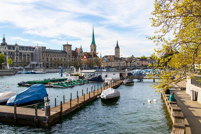 Private Tour of Zurich in 60 minutes with a Local - Old town alley charm with pastel shutters and flags