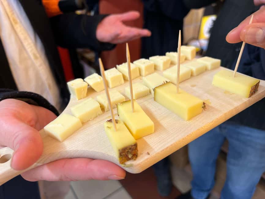 Zurich: Food Tour of 8+ Tastings with Cheeses & Chocolates - Sausage shop stop: Zurich’s classic with sauerkraut and mustard